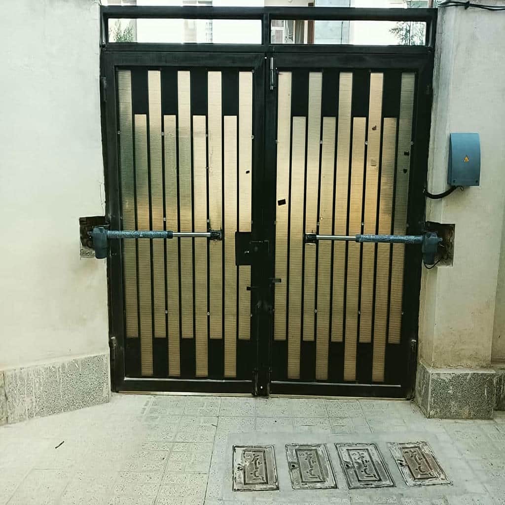 نصب جک درب پارکینگ ایرانی بازویی روی ستون فلزی