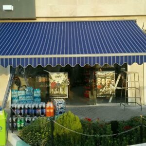سایبان برقی طوسی بالای پیشخوان دوچرخه فروشی قزوین